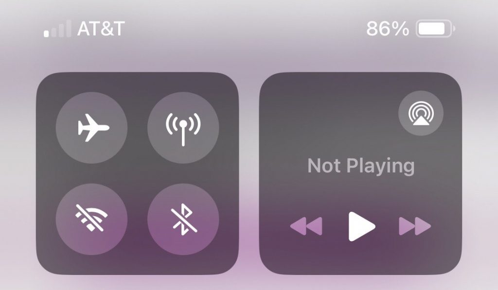 iPhone Control Center illustrating temporary Wi-Fi and Bluetooth controls that continue background wireless activity.